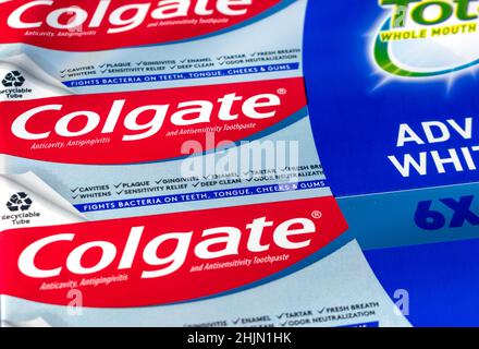 Colgate sign on anticavity, antigingivitis and sensitivity toothpaste pack. Selective focus - San Jose, California, USA - 2022 Stock Photo