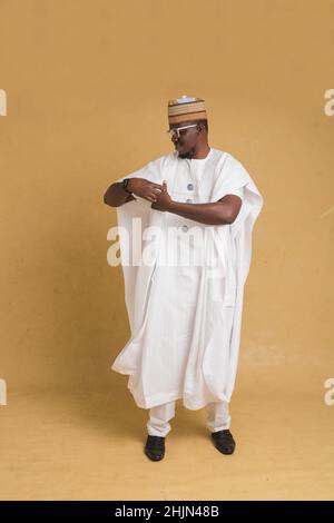 A Traditionally Dressed Northern Business Man Walking Stock Photo