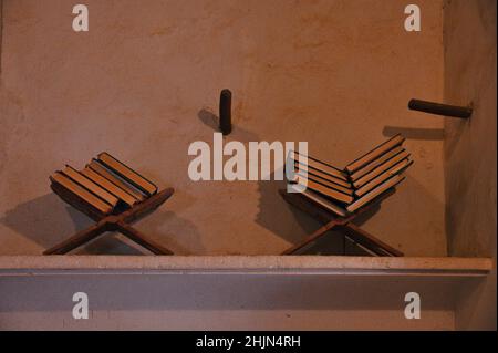 Old wooden bookstand on the wall in Oman mosque Stock Photo