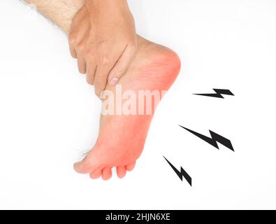 Tingling and burning sensation in foot of Asian young man with diabetes. Sensory neuropathy problems. Foot nerves problems. Plantar fasciitis. Isolate Stock Photo