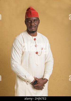 Yoruba Culturally Dressed Business Man with Hands Clasped Close-up Stock Photo