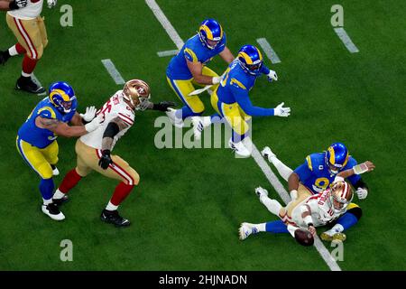 Inglewood, United States. 31st Jan, 2022. San Francisco 49ers quarter Jimmy Garoppolo (10) throws a fourth quarter interception while in the arms of Los Angeles Rams Aaron Donald during the NFC Championship game at SoFi Stadium in Inglewood, California on Sunday, January 30, 2022. The Rams defeated the Niners 20-17. Photo by Jon SooHoo/UPI Credit: UPI/Alamy Live News