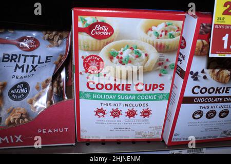 A closeup of Betty Crocker Cookie Cups Holiday Sugar Cookies mixes  in boxes on a metal shelf at a Dillons grocery store in Kansas Stock Photo