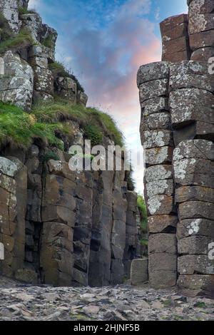 Northern Ireland Sea Coast Sunset,  Antrim landscapes, Giants of Causeway , Stone pillars, Land of Myths and Legends, Northern Ireland Stock Photo