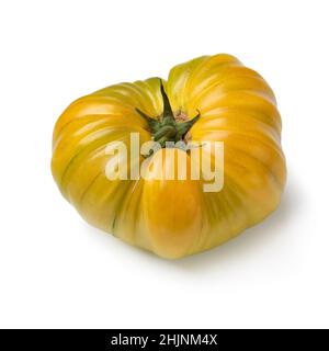 Single yellow coeur de boeuf tomato isolated on white background Stock Photo