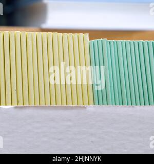 Books, brochures or notebooks on a shelf in the library Stock Photo