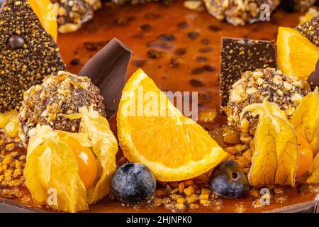 Close up of modern cake decoration with fresh fruit and chocolate on top Stock Photo
