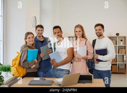 Group portrait of happy diverse students with backpacks Stock Photo