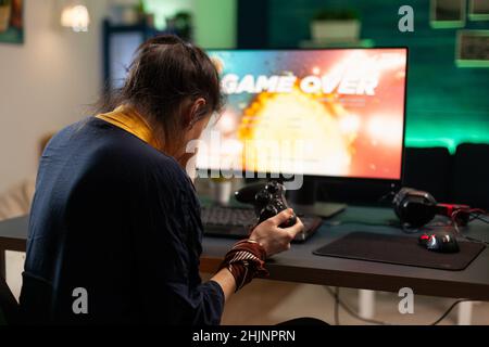 Angry woman playing online video games with joystick. Gamer using controller  on computer to play internet games and losing. Disappointed person with  electronic gaming equipment Stock Photo - Alamy