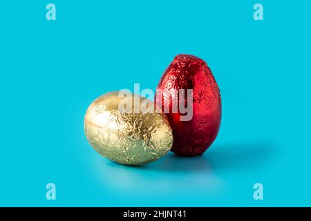 Red and golden Easter eggs on blue background Stock Photo