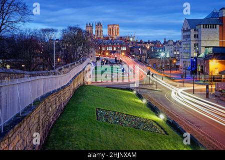 UK,North Yorkshire,York, City Walls with city centre and York Minster in the distance during blue hour. Stock Photo