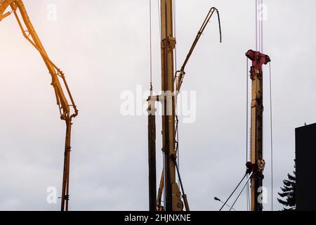 Concrete pouring during commercial concreting floors of building in construction site Stock Photo