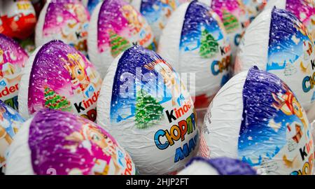 Moscow, Russia, November 2020: Close-up of many Kinder surprise chocolate eggs in Christmas packaging with reindeer. Stock Photo