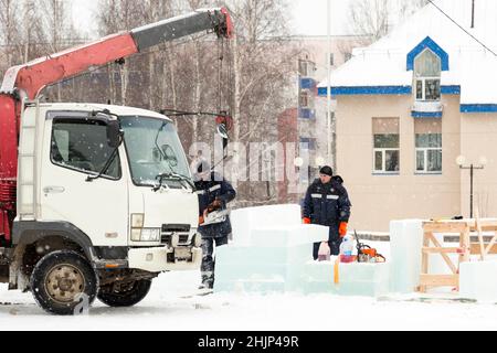 Workman assembler customize chainsaw ice plate Stock Photo