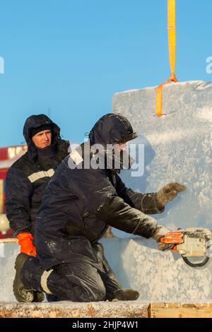 Workman assembler customize chainsaw ice plate Stock Photo