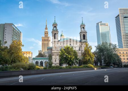 All Saints Church and Palace of Culture and Science - Warsaw, Poland Stock Photo