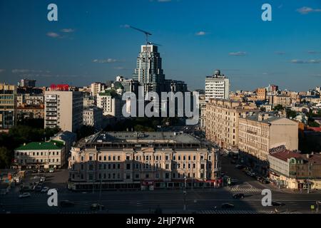 Construction of new skyscraper office building in Moscow downtown. Garden Ring, Triumfalnaia square. Evening light, blue sky. Crane working. Stock Photo