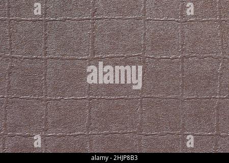 Background from brown paper embossed with irregular squares. Close-up Stock Photo