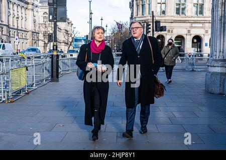 WESTMINSTER LONDON, UK. 31 January, 2022.   Yvette Cooper (L), shadow home secretary and member of parliament for Normanton, Pontefract and Castleford, walking  with  her husband Ed Balls who served as the  shadow chancellor of the exchequer  from 2011-2015  Credit: amer ghazzal/Alamy Live News Stock Photo