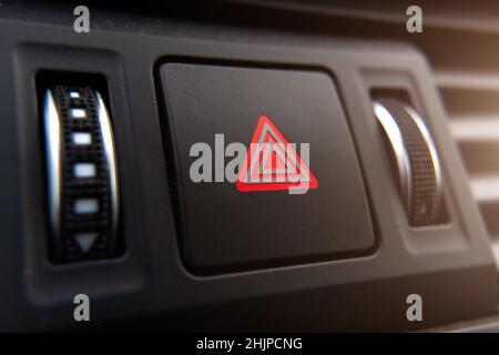 the emergency stop button of the car is a close-up on the dashboard. Stock Photo