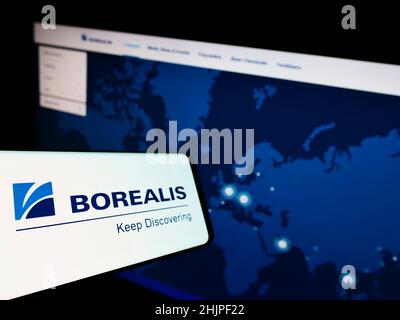 Mobile phone with logo of Austrian chemical company Borealis AG on screen in front of business website. Focus on left of phone display. Stock Photo