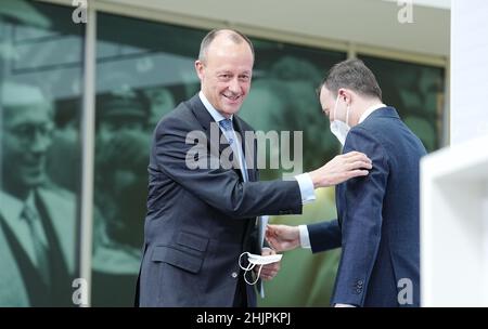 31 January 2022, Berlin: Friedrich Merz (l), new CDU party chairman, bids farewell to Paul Ziemiak, CDU member of the Bundestag and former CDU secretary-general, at the start of a press conference following the announcement of the postal election results for the CDU party leadership. Merz is now also officially the new CDU chairman. The 66-year-old economic politician received 95.33 percent of the vote in the postal ballot, according to CDU figures on Monday. This written vote was necessary for legal reasons after the online party conference on January 22. Photo: Kay Nietfeld/dpa Stock Photo