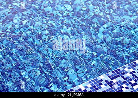 Swimming pool water background. Rippled water in swimming pool. Stock Photo