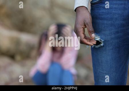 Man with black skin leaving his sad caucasian girlfriend alone Stock Photo