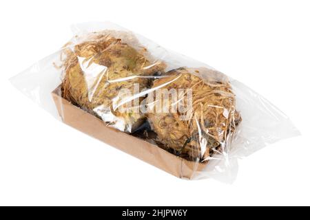 Packaged and labeled root celery on an isolated white background Stock Photo