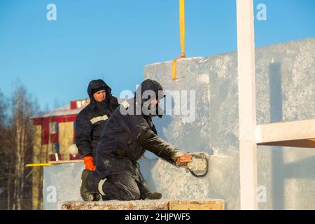 Workman assembler customize chainsaw ice plate Stock Photo