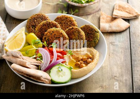 Baked falafel bowl with hummus and vegetables Stock Photo