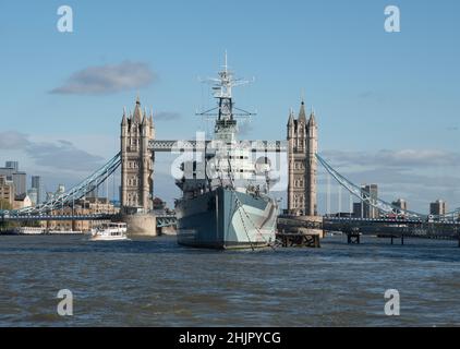 HMS Belfast moored near Tower Bridge on the River Thames, London Stock Photo