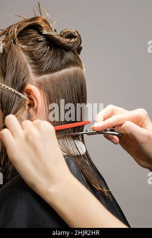 Fashion Trendy Hairdo. Bob Haircut Technology Classic Version. Little Girl  with Short Bob Hair. Close Up Side View. Hairtician Cuts her Hair. Modern  Children Hairstyle Stock Photo - Alamy