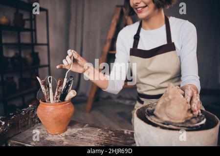 Cropped photo of self employed lady potter do order occupation decorate form porcelain pot use equipment in workroom Stock Photo