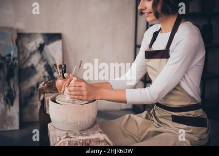 Cropped photo of pottery artwork owner lady do porcelain earthenware pot form hands use tool equipment Stock Photo