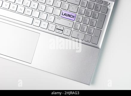 Launch word on laptops keyboard. Start up, new IT project concept. Stock Photo