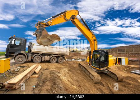 excavator working on construction site Stock Photo