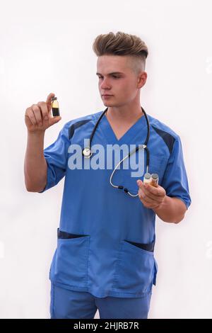 Medical concept. Doctor with ampoules posing isolated on white. Stock Photo