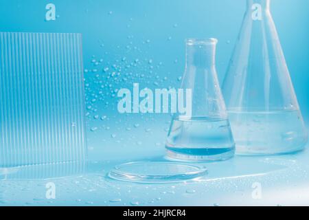 Empty podium with glass labware, flask bowl platform. Research and development of cosmetics in the laboratory. Stock Photo