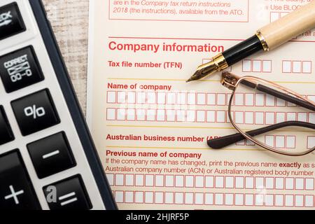 Australian tax declaration and pen on wooden table Stock Photo