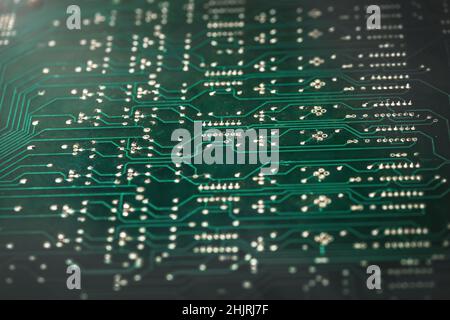 close up - the tracks on the green motherboard . Stock Photo