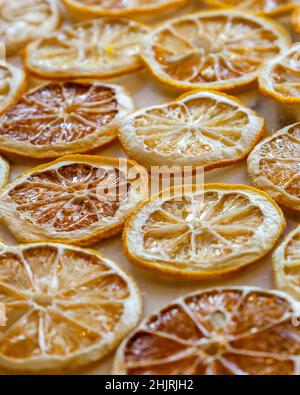 Dried oranges and lemons on a marble counter Stock Photo