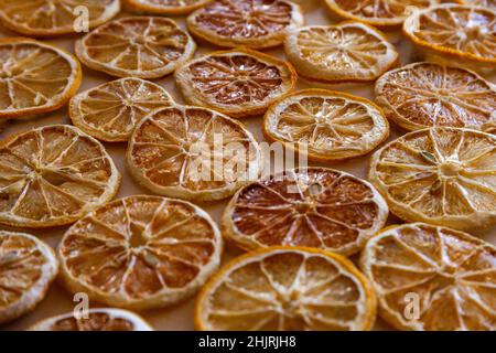 Dried oranges and lemons on a marble counter Stock Photo