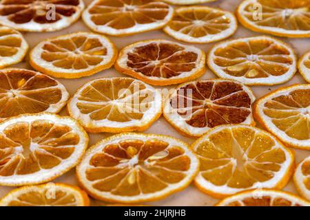 Dried oranges and lemons on a marble counter Stock Photo