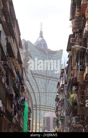 Vertical shot of the Grand Lisboa against the Macau street Stock Photo