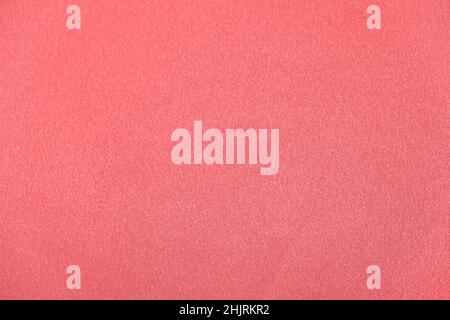 Light pink satin fabric texture, beautiful pattern in dusty rose color, top view. Stock Photo