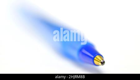 Closeup of blue ball point pen for business or education blurry blured Stock Photo
