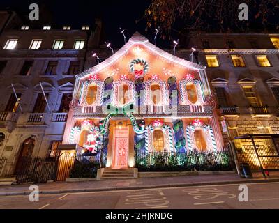 Christmas In England 2022 London, Greater London, England, January 4Th 2022: Man Walks By Anabels  Private Club With Its Christmas Gingerbread House Facade In Berkeley Square  Stock Photo - Alamy