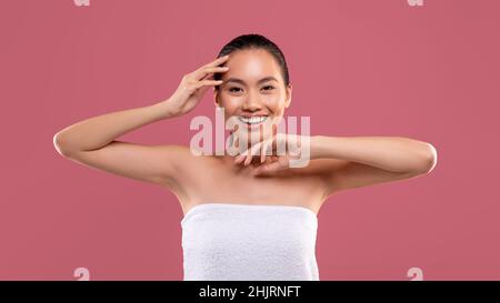 Happy asian woman showing her clean and hairless armpits Stock Photo