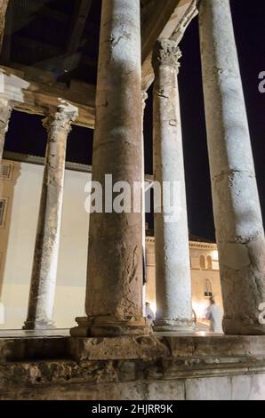 The Ancient Roman Temple of Augustus at Night. A Well Preserved Monument. Close up View of the Columns. Unique Architectural Greek Classical Style. Stock Photo